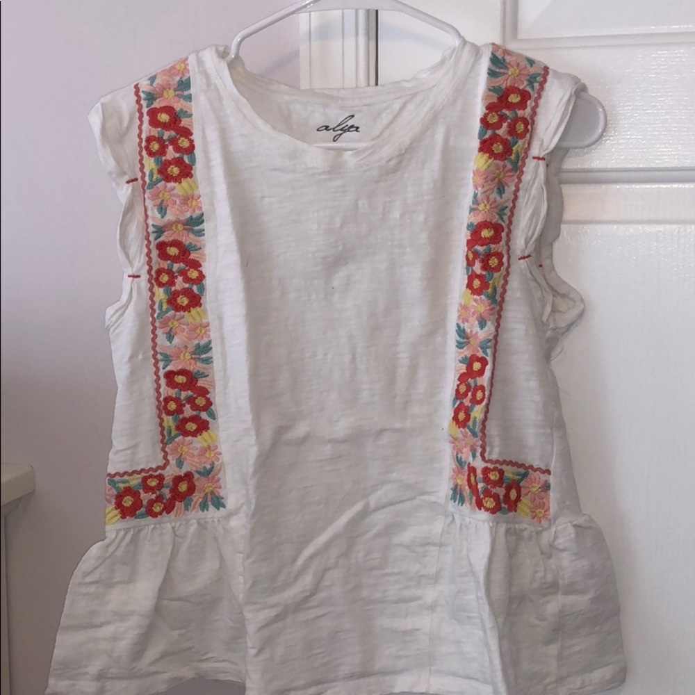 white flowy tank with flower embroidery